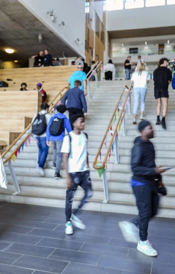 Students walking up the central staircase at Glasgow Kelvin College Springburn campus during a busy Open Day event Students walking up the central staircase at Glasgow Kelvin College Springburn campus during a busy Open Day event